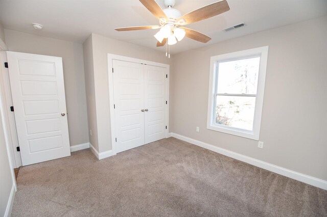 100 Winterhaven, Spartanburg, SC 29301 - unfurnished bedroom featuring a closet, a ceiling fan, visible vents, carpet floors, and baseboards