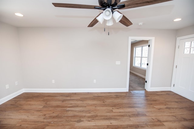 100 Winterhaven, Spartanburg, SC 29301 - unfurnished room with a wealth of natural light, ceiling fan, wood finished floors, and baseboards