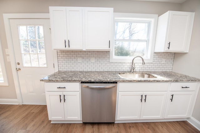 100 Winterhaven, Spartanburg, SC 29301 - kitchen with stainless steel dishwasher, light wood-type flooring, a sink, and light stone counters
