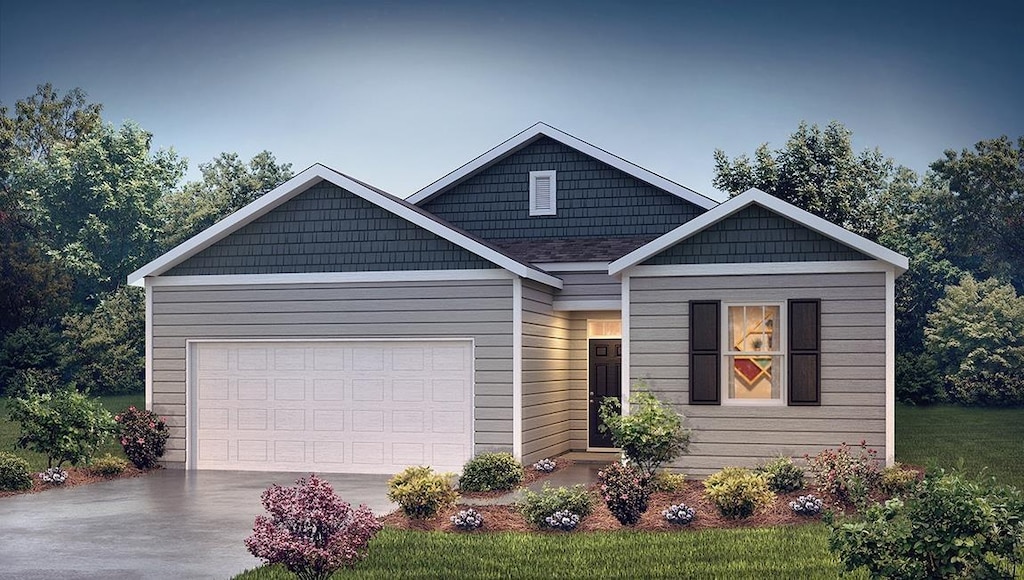 view of front of home featuring a garage and driveway