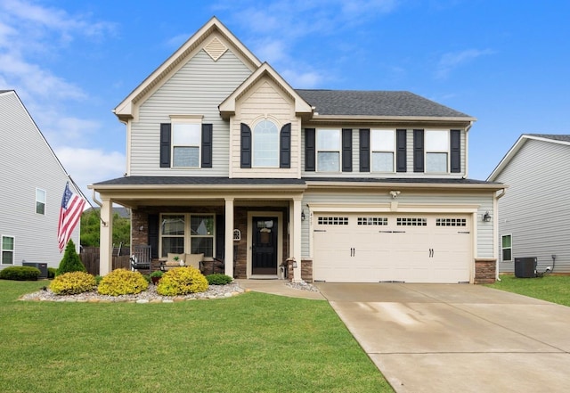 view of front of house with covered porch, a front lawn, an attached garage, concrete driveway, and central AC unit