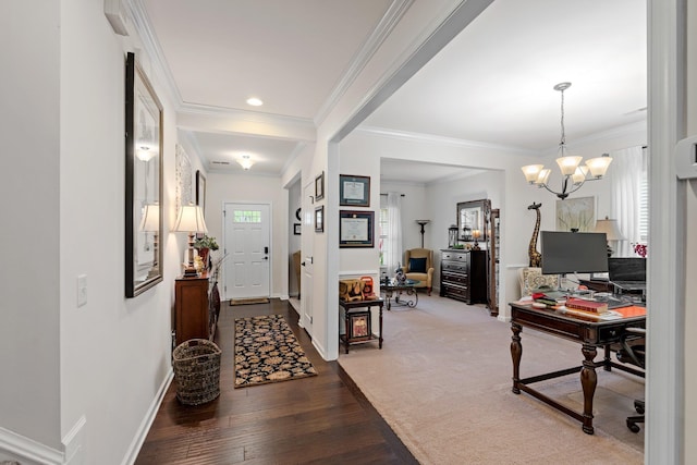 entrance foyer featuring baseboards, a wealth of natural light, a chandelier, and wood finished floors