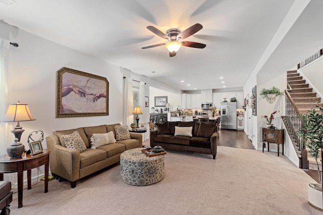 living area with recessed lighting, stairway, baseboards, and a ceiling fan