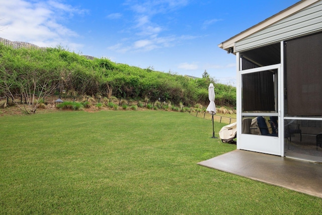 view of yard featuring a sunroom