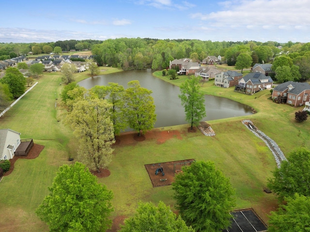 drone / aerial view featuring a water view and a residential view