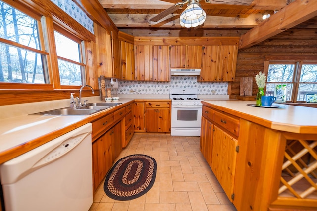 144 Lakeshore, Chesnee, SC 29323 - kitchen with beamed ceiling, white appliances, under cabinet range hood, light countertops, and a sink