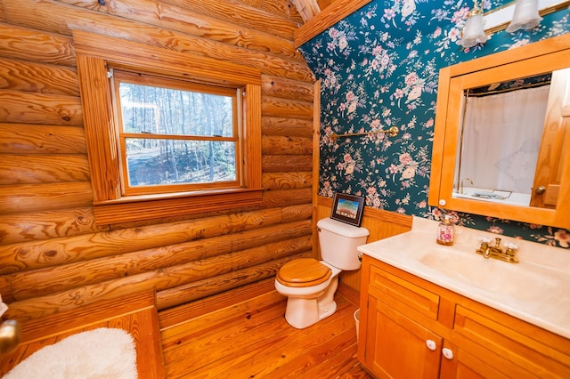 144 Lakeshore, Chesnee, SC 29323 - full bathroom with log walls, toilet, hardwood / wood-style flooring, vanity, and wallpapered walls