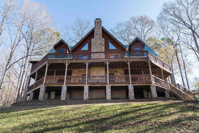144 Lakeshore, Chesnee, SC 29323 - rear view of house featuring a chimney, stone siding, stairway, and a lawn