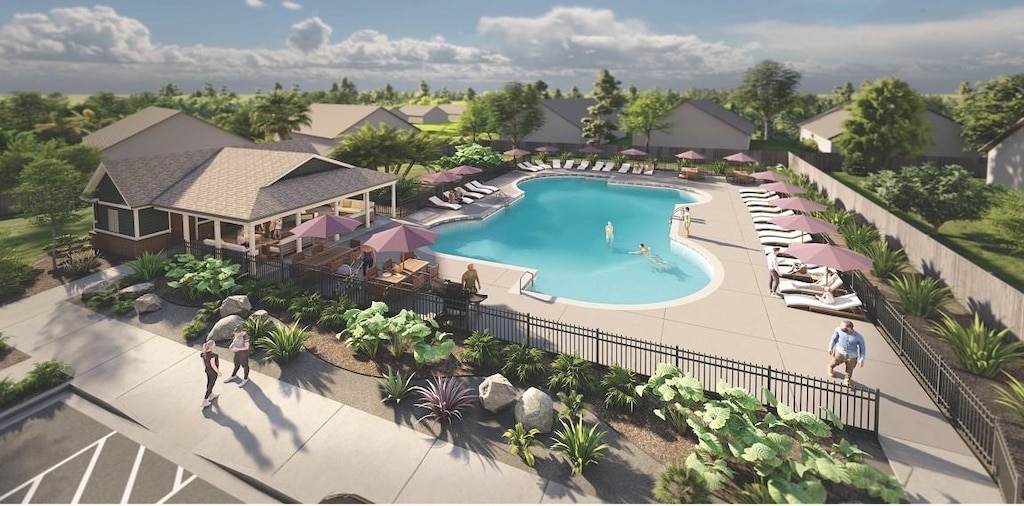 community pool with a patio and fence