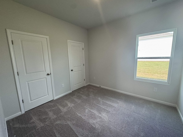 1419 Macedonia, Gaffney, SC 29341 - unfurnished bedroom featuring dark colored carpet and baseboards