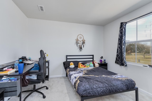 bedroom with carpet flooring, visible vents, and baseboards