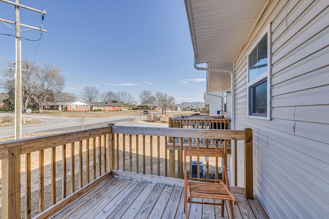 wooden terrace featuring a residential view