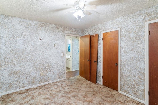 221 Lakeview, Liberty, SC 29657 - unfurnished bedroom with wallpapered walls, ceiling fan, carpet flooring, and a textured ceiling
