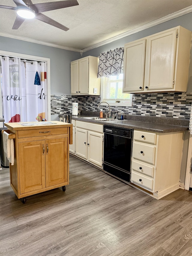 kitchen with dishwasher, a sink, crown molding, wood finished floors, and decorative backsplash