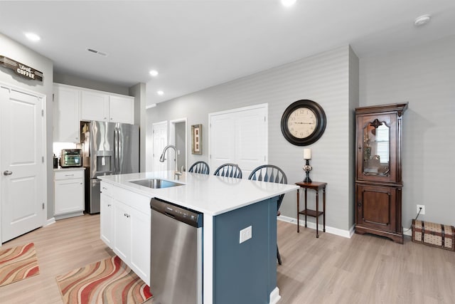 122 Aleppo, Greer, SC 29651 - kitchen with a sink, white cabinets, appliances with stainless steel finishes, and light wood-style floors