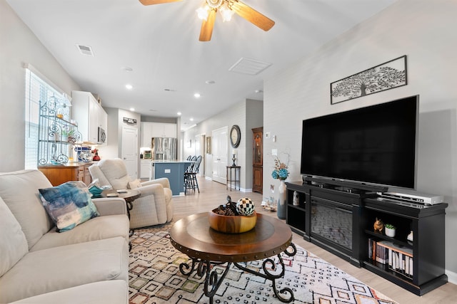 122 Aleppo, Greer, SC 29651 - living room featuring baseboards, light wood-style floors, visible vents, and a ceiling fan
