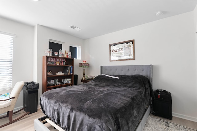 122 Aleppo, Greer, SC 29651 - bedroom with visible vents, light wood-style flooring, multiple windows, and baseboards