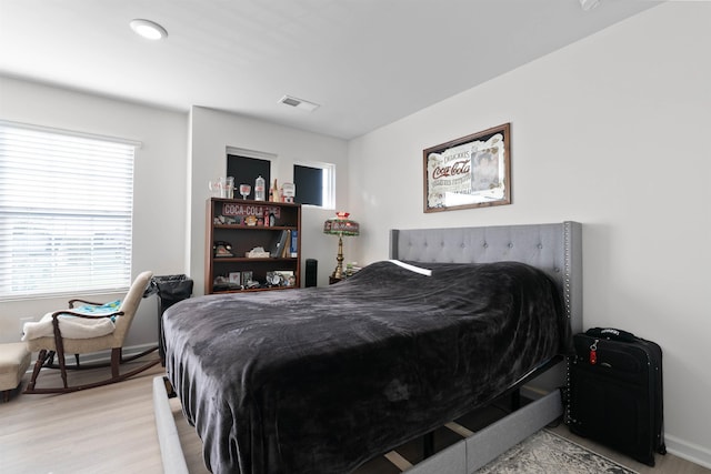 122 Aleppo, Greer, SC 29651 - bedroom with baseboards, light wood-style floors, multiple windows, and visible vents