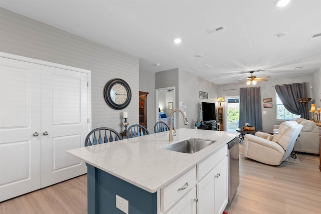 122 Aleppo, Greer, SC 29651 - kitchen with stainless steel dishwasher, light wood-type flooring, visible vents, a sink, and open floor plan