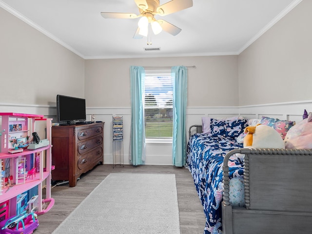 110 Miller Spgs, Moore, SC 29369 - bedroom with wainscoting, ceiling fan, ornamental molding, and wood finished floors