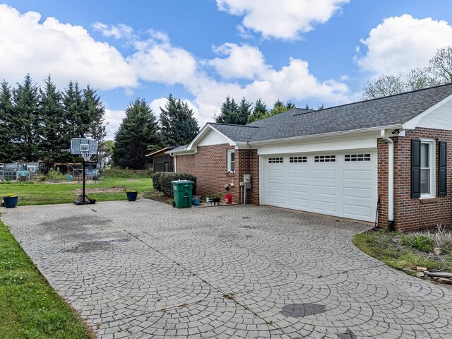 110 Miller Spgs, Moore, SC 29369 - view of home's exterior featuring brick siding, a lawn, a garage, and aphalt driveway
