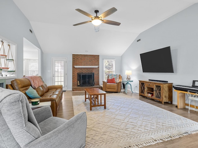 110 Miller Spgs, Moore, SC 29369 - living room with lofted ceiling, baseboards, a brick fireplace, ceiling fan, and wood finished floors