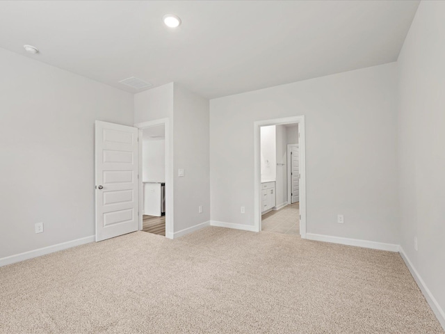 217 Merriweather, Spartanburg, SC 29301 - unfurnished bedroom with light colored carpet, baseboards, recessed lighting, and connected bathroom