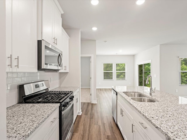 217 Merriweather, Spartanburg, SC 29301 - kitchen featuring stainless steel appliances, a sink, dark wood-style flooring, white cabinets, and recessed lighting