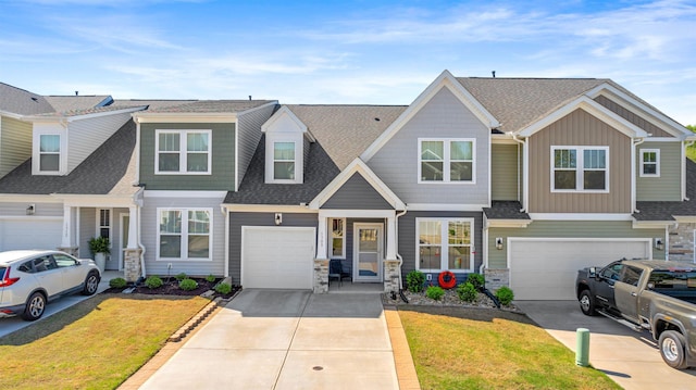 1308 Summer Gold, Boiling Springs, SC 29316 - view of front of property featuring driveway, stone siding, board and batten siding, an attached garage, and a shingled roof