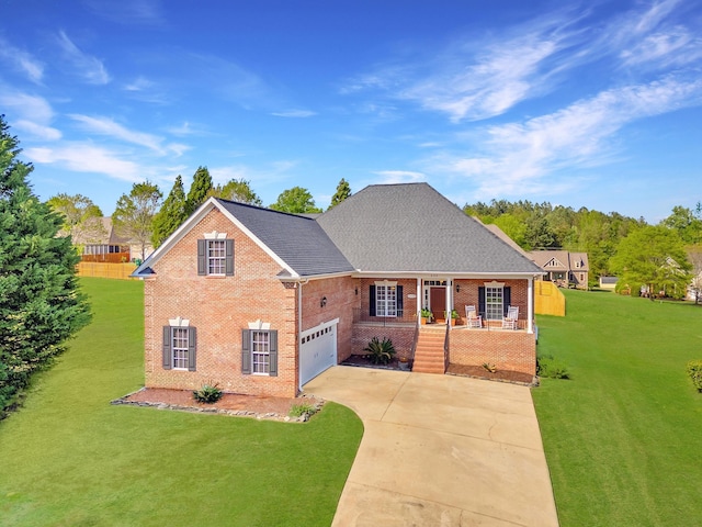 208 W Coosaw, Roebuck, SC 29376 - traditional home featuring a shingled roof, covered porch, concrete driveway, brick siding, and a front lawn