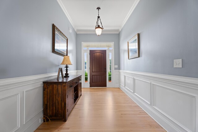 208 W Coosaw, Roebuck, SC 29376 - entrance foyer with crown molding, a decorative wall, wainscoting, and light wood-style floors