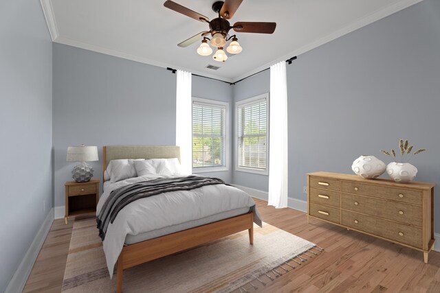 208 W Coosaw, Roebuck, SC 29376 - bedroom featuring crown molding, baseboards, visible vents, and light wood-type flooring