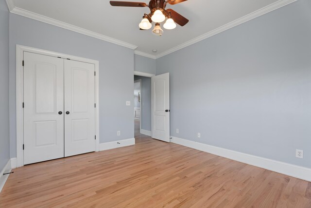 208 W Coosaw, Roebuck, SC 29376 - unfurnished bedroom with light wood-style floors, crown molding, a closet, a ceiling fan, and baseboards