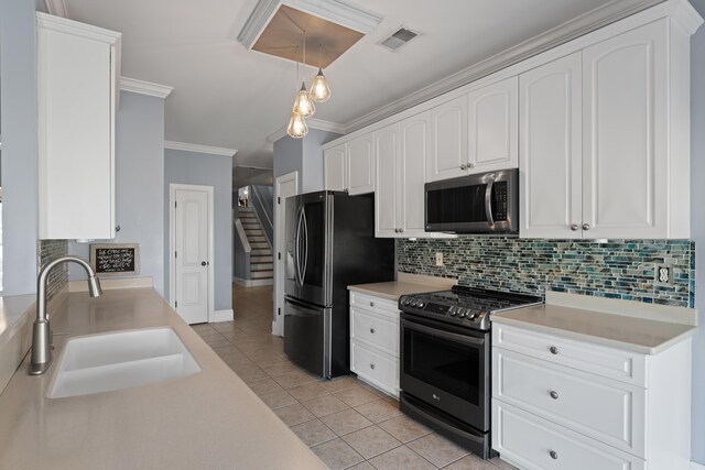 208 W Coosaw, Roebuck, SC 29376 - kitchen with light tile patterned floors, crown molding, visible vents, appliances with stainless steel finishes, and a sink
