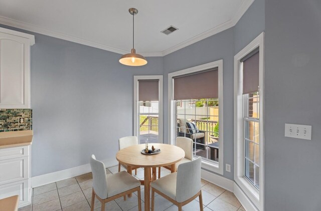 208 W Coosaw, Roebuck, SC 29376 - dining space with crown molding, visible vents, baseboards, and light tile patterned floors