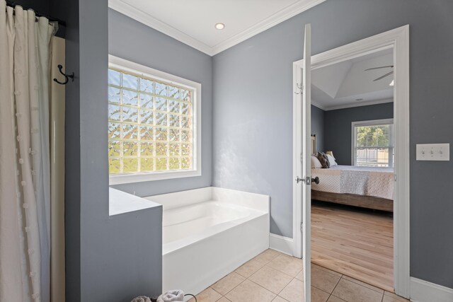 208 W Coosaw, Roebuck, SC 29376 - ensuite bathroom featuring tile patterned floors, a garden tub, ensuite bath, and ornamental molding