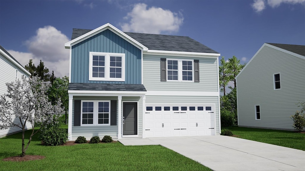 traditional-style house featuring a garage, roof with shingles, a front yard, and driveway