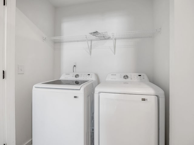 clothes washing area featuring laundry area and independent washer and dryer