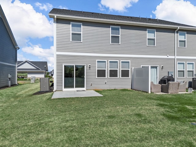 back of property featuring a yard, central AC unit, and a patio area