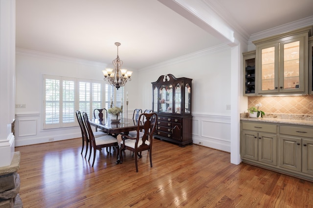 865 Westmoreland, Greer, SC 29651 - dining area with an inviting chandelier, crown molding, and light wood-style floors