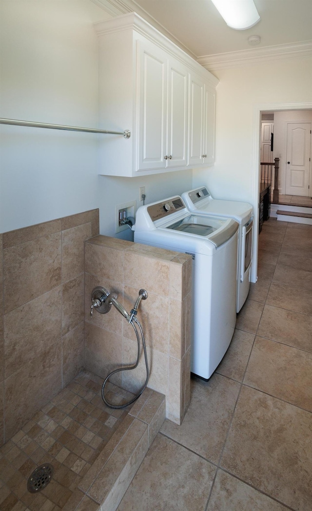 865 Westmoreland, Greer, SC 29651 - washroom with ornamental molding, washing machine and clothes dryer, cabinet space, and light tile patterned floors
