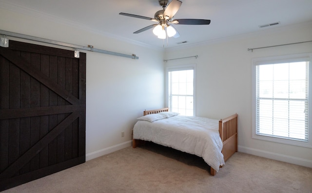 865 Westmoreland, Greer, SC 29651 - bedroom with a barn door, visible vents, crown molding, and light colored carpet