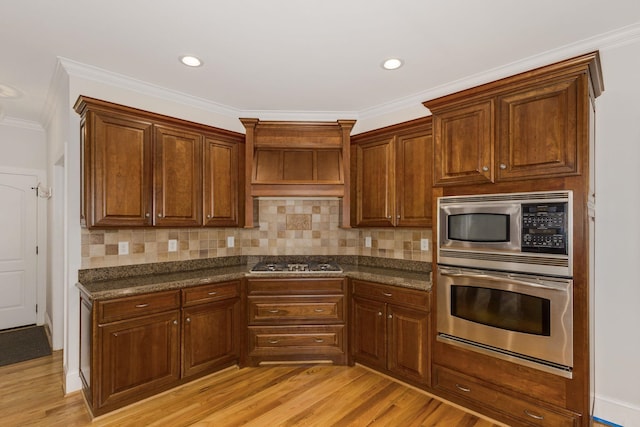 6 Pepper Bush, Greer, SC 29651 - kitchen with light wood-style floors, appliances with stainless steel finishes, and tasteful backsplash