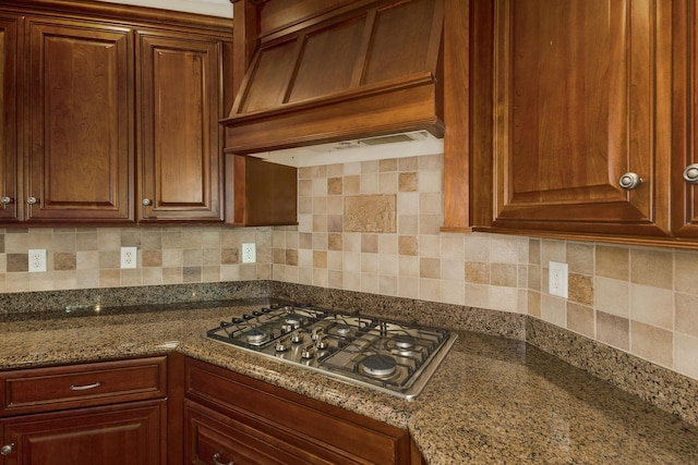 6 Pepper Bush, Greer, SC 29651 - kitchen with stainless steel gas cooktop, dark stone countertops, backsplash, and premium range hood
