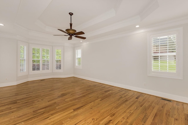 6 Pepper Bush, Greer, SC 29651 - spare room with a raised ceiling, light wood-type flooring, visible vents, and ornamental molding