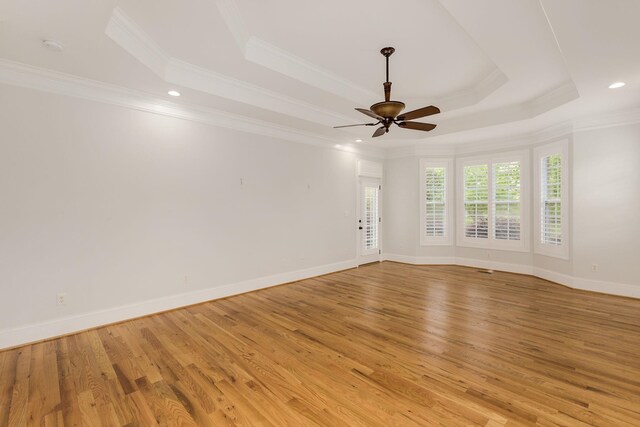 6 Pepper Bush, Greer, SC 29651 - spare room featuring a raised ceiling, ceiling fan, light wood finished floors, and ornamental molding