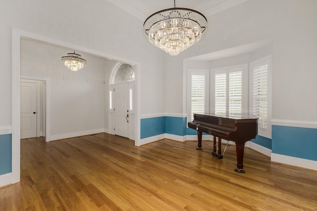 6 Pepper Bush, Greer, SC 29651 - foyer entrance featuring light wood finished floors, baseboards, an inviting chandelier, and a healthy amount of sunlight