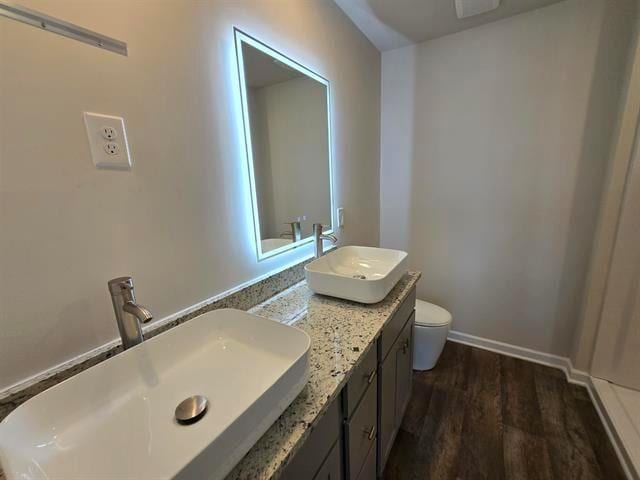 1036 Cargo, Spartanburg, SC 29306 - full bathroom featuring toilet, wood finished floors, a sink, and double vanity