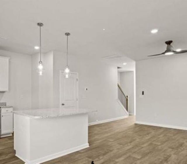 1036 Cargo, Spartanburg, SC 29306 - kitchen with ceiling fan, decorative light fixtures, white cabinets, dark wood-style flooring, and a kitchen island