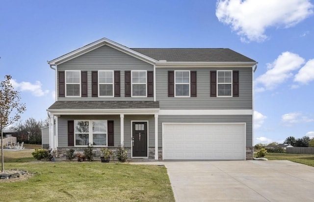 view of front of house featuring a front lawn, driveway, stone siding, covered porch, and an attached garage